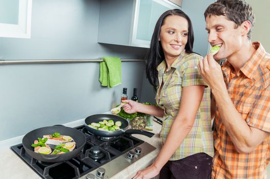 Portrait of a young couple at kitchen