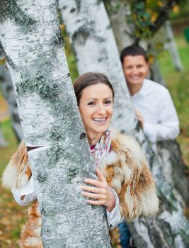 Portrait of romantic happy young beautiful couple on autumn walk. Vertical view