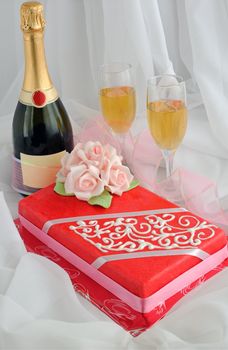 Rectangular cake with marzipan roses and champagne by the glass