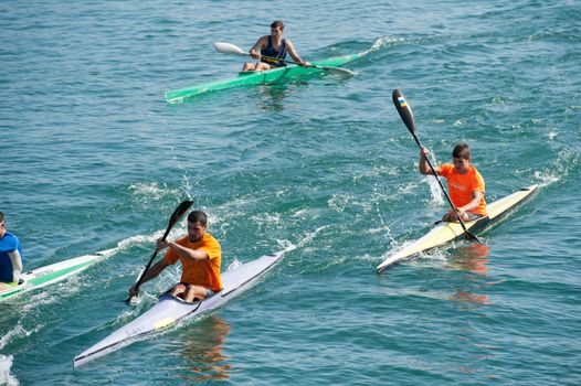 LAS PALMAS, SPAIN – MARCH 11: Unidentified men from club amigos del piraguismo in Canary Islands, kayaking during Boat and Marine Expo FIMAR 2012 on March 11, 2012 in Las Palmas, Spain
