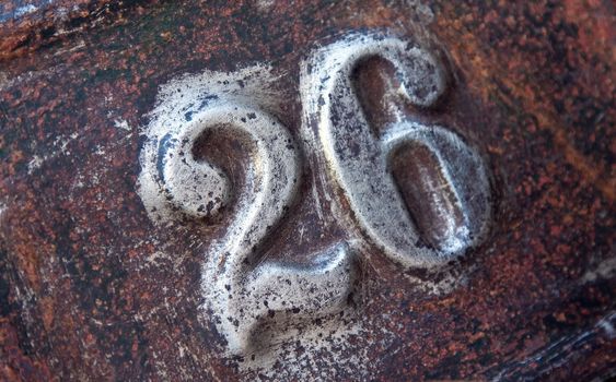 house number on rusty iron plate 