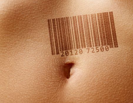 Close up stomach of woman with barcode