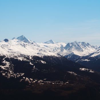 top of mountains sun in blue sky