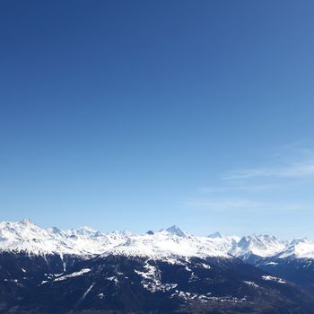 top of mountains sun in blue sky