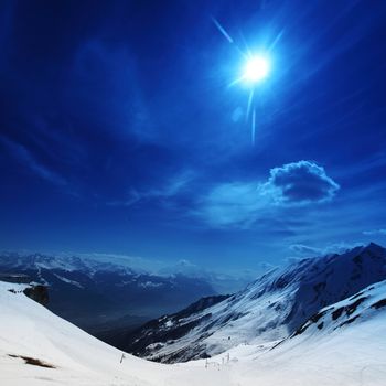 top of mountains in blue sky
