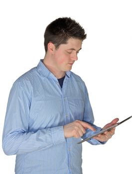 A picture of a young man with shirt touching a tablet.