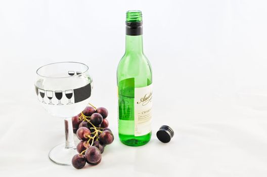 Bunch of Grapes, wine glass  and bottle of wine