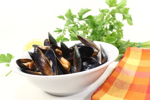 fresh steamed mussels in a bowl with napkin