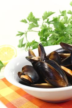 fresh cooked mussels in a bowl with napkin