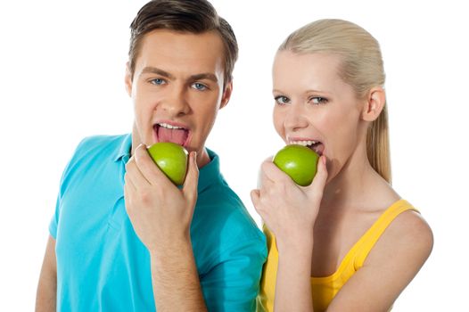 Healthy couple having fresh green apple together