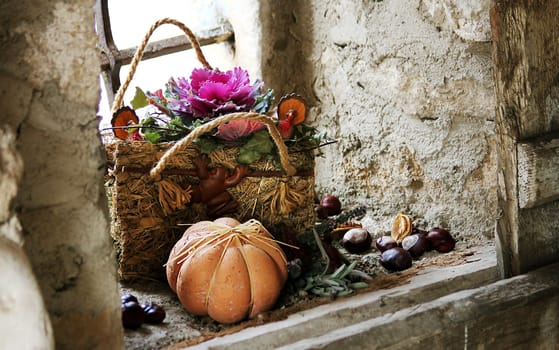 nice harvest decoration with straw bag and pumpkin