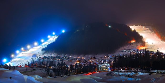 Winter ski resort at night in the mountains