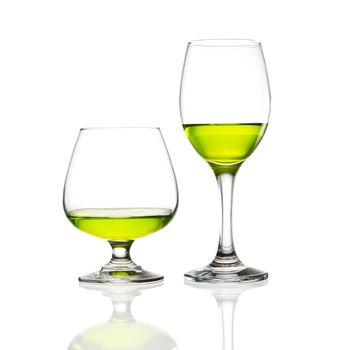 wine glass and green cocktail isolated