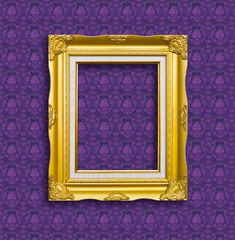 frame of golden wood  on purple wallpaper
