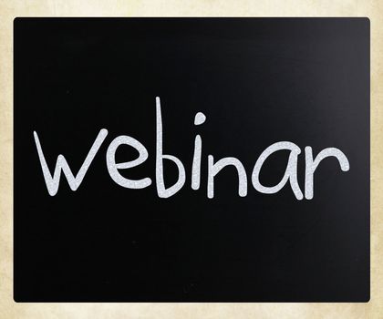 The word "Webinar" handwritten with white chalk on a blackboard