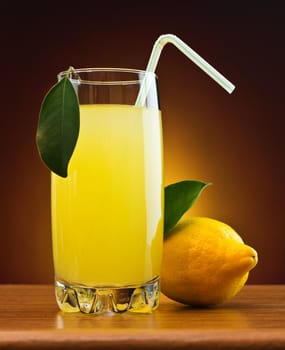 orange juice in a glass on a table with oranges