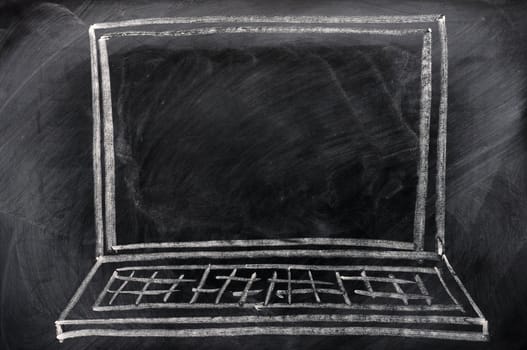 Chalk drawing of Laptop on a blackboard, with copy space on the screen