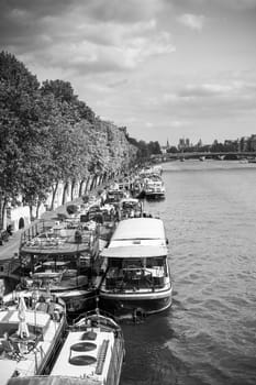 Living barge on the Seine in Paris with Eiffel tower background. France