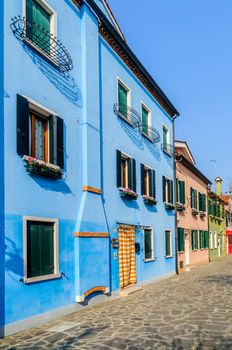 Panorama of the colorful houses Burano. Italy. Vertical view