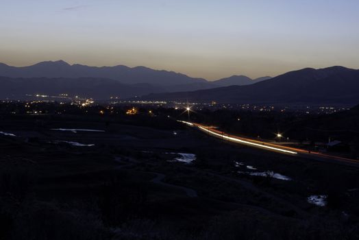 looking down over river and traffic blur and city scape sunset