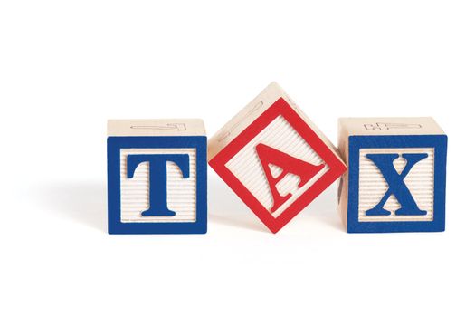 Alphabet blocks arranged to spell the word, "tax" with the letter 'a' askew. Isolated on white with clipping path.