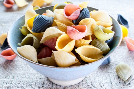 Multi colored pasta on coarse cloth