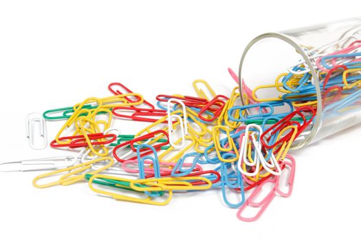 color paperclip spilled on the white background