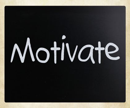 "Motivate" handwritten with white chalk on a blackboard