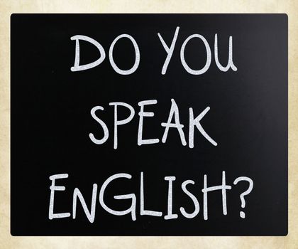 "Do you speak english" handwritten with white chalk on a blackboard
