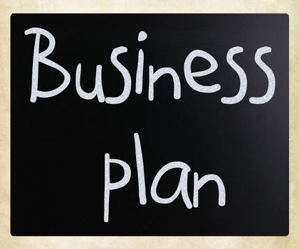 "Business plan" handwritten with white chalk on a blackboard