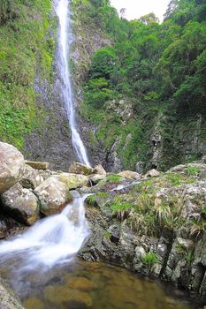 The beautiful waterfall in forest, spring, long exposure 