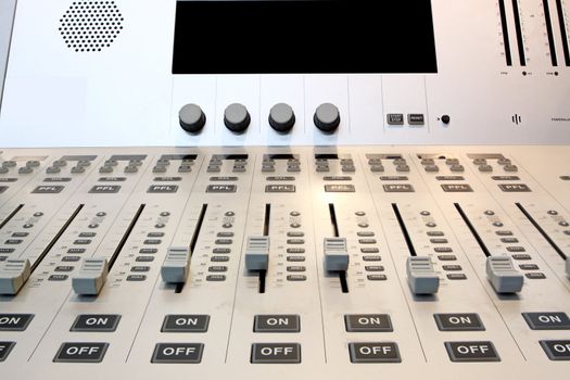 Part of an audio sound mixer with buttons 