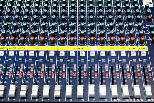 Part of an audio sound mixer with buttons 