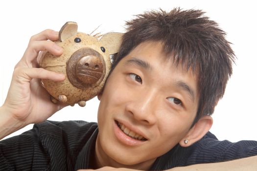 asia man with piggy bank 