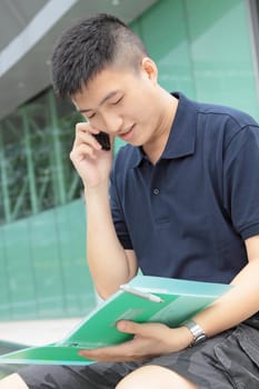 Portrait of businessman calling by phone 