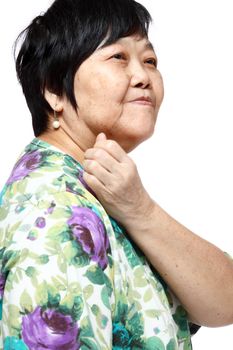 senior woman holding her aching back , massage herself