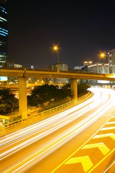 Traffic at night with traces of lights left by the cars on a highway 