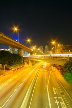 Traffic at night with traces of lights left by the cars on a highway 