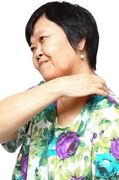 senior woman holding her aching back , massage herself
