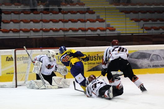 ZELL AM SEE; AUSTRIA - NOV 6: Austrian National League. Petr Vala number 16 of EK Zell am See tries to score against the team of Dab. Docler Dunaujvaros. Game EK Zell am See vs Dab. Docler Dunaujvaros (Result 2-3) on November 6, 2011.