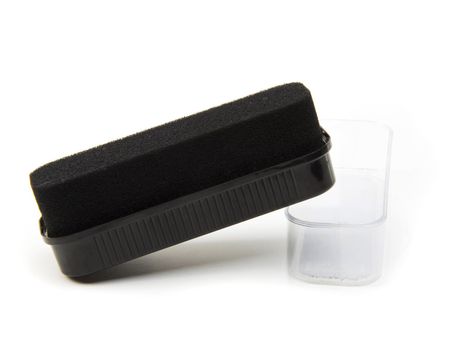 Black sponge for care of footwear, it is isolated on the white