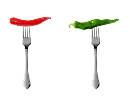 Red hot chili pepper with yellow green pepper pricked on forks isolated on white
