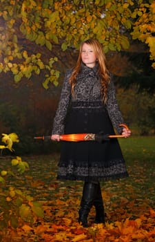 beautiful girl in autumn forest