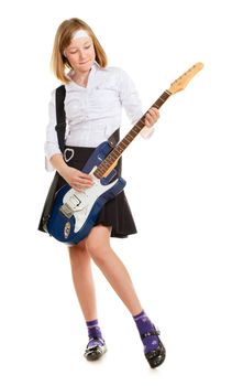 teen girl playing on a guitar, isolated on white