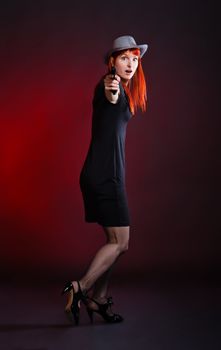 crazy woman with pistol run away, red background