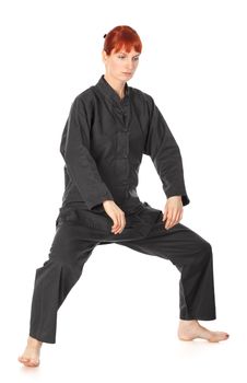 girl in black kimono exercise, isolated on white