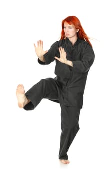 girl in black kimono exercise, isolated on white