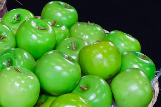 green apple in bamboo basket