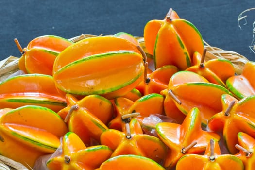 pile of star fruits in bamboo basket