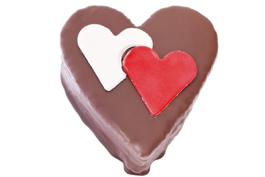 Heart shaped slice of a chocolate-cake on white background